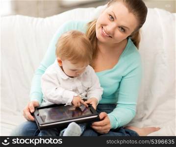 happy mother and adorable baby with tablet pc