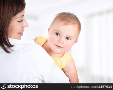 Happy mother and baby portrait, people having fun at home, healthy family enjoying life, parenting lifestyle
