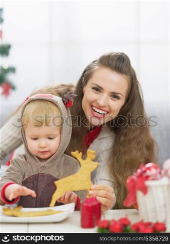 Happy mother and baby spending christmas time together