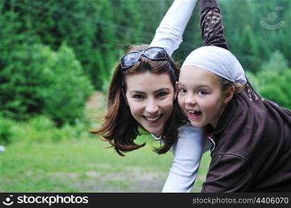 happy mother and child outdoor in natre