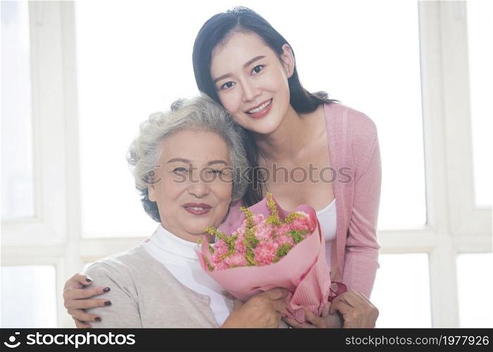 Happy mother and daughter and gifts