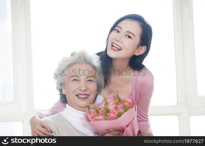 Happy mother and daughter and gifts