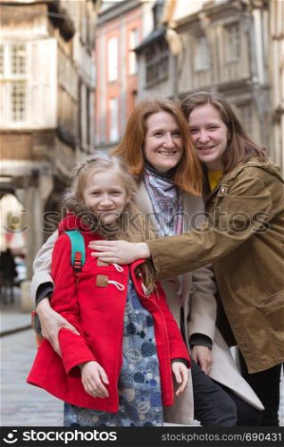 happy mother and daughters in the famous city of Dinan. Normandy, France