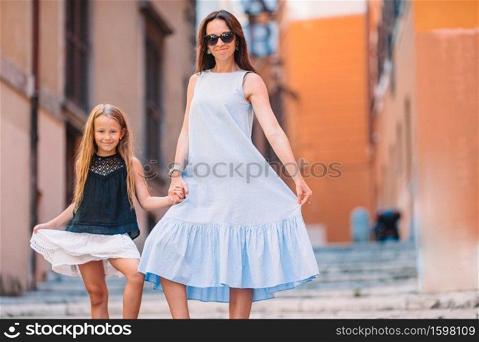 Happy mother and little adorable girl in Rome during summer italian vacation. Family european vacation.. Happy mom and little adorable girl traveling in Rome, Italy