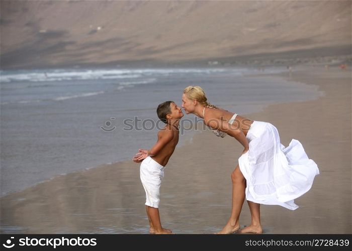 Happy Mother and son on the beach