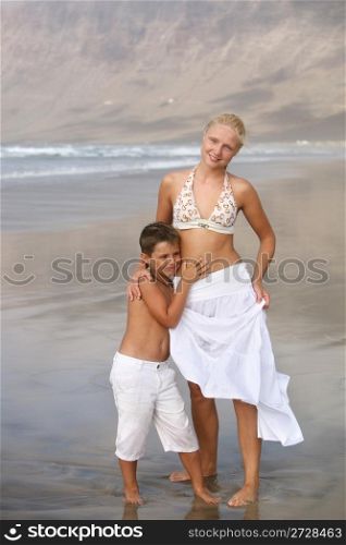 Happy Mother and son on the beach