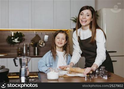 happy mother daughter cooking kitchen