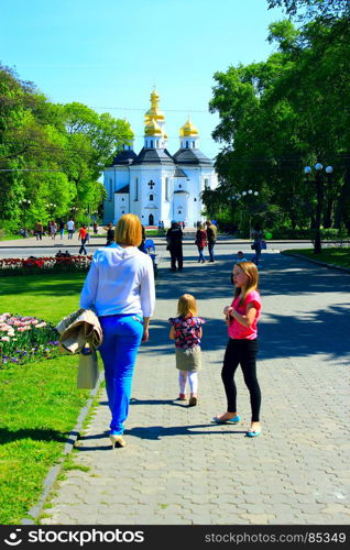 happy mother walks with her daughters. happy mother walks with her daughters in the spring park