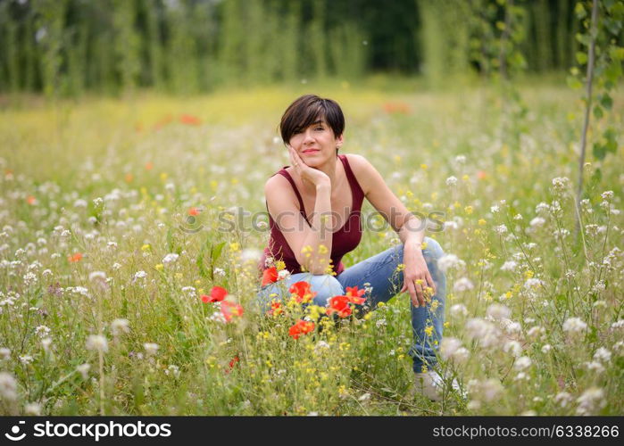 Happy mother with her little daughter in poppy field