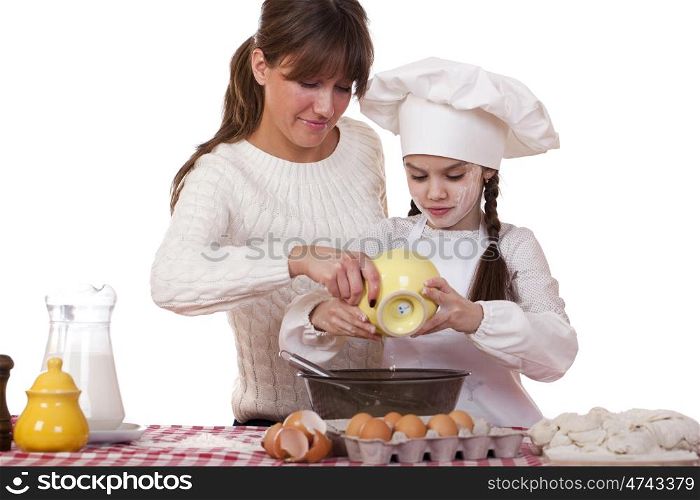 Happy mother with little daughter joyful cooking, isolated on white background