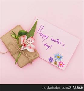 happy mothers day inscription with flower gift