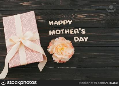 happy mothers day inscription with gift box flower