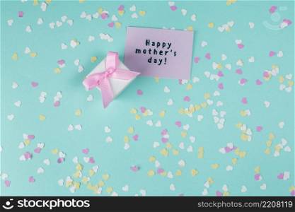 happy mothers day inscription with small gift box