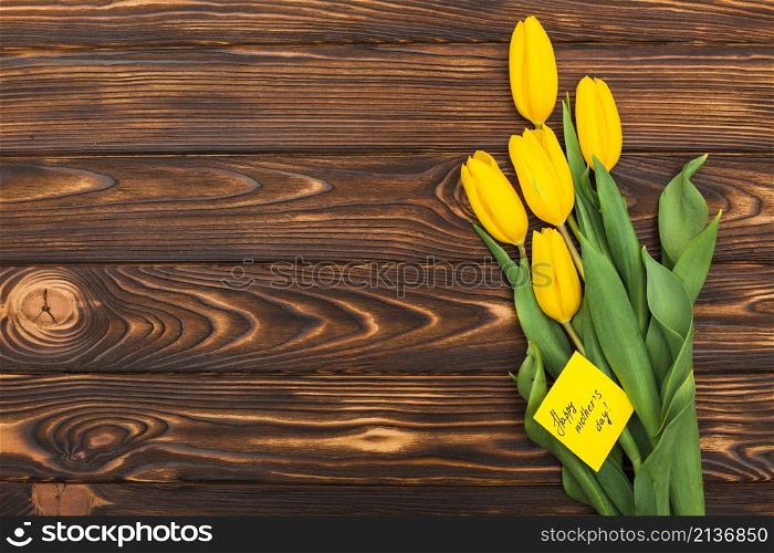 happy mothers day inscription with tulip flowers