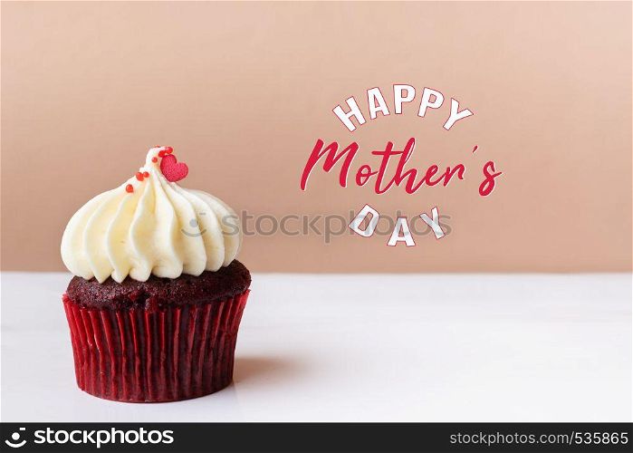 Happy Mothers Day, sweet red heart on white cream cupcake
