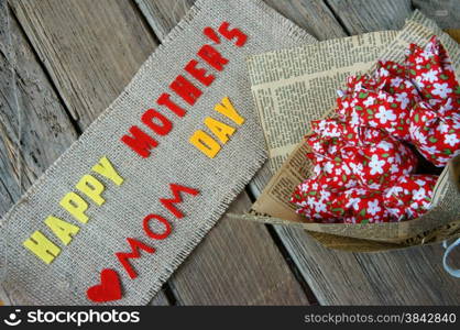 Happy mothers day with i love you mom message, idea from colorful fabric starfish on wooden background, beautiful flower, abstract wooden texture, mother&rsquo;s day is day for mom, love of family