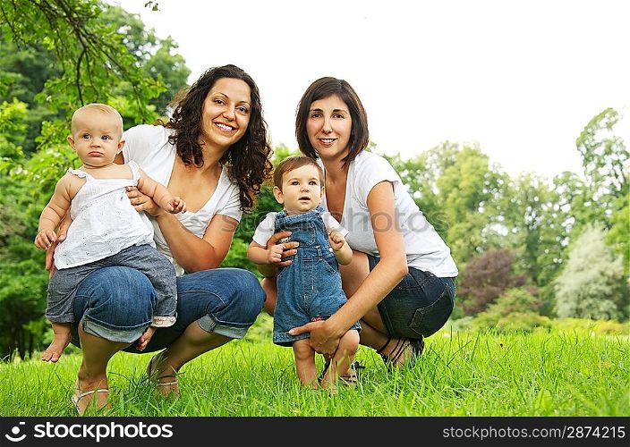 Happy mothers with their babies outdoors.