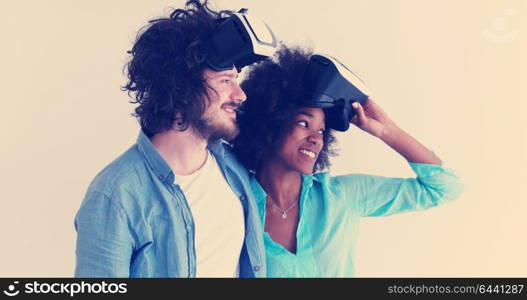 Happy multiethnic couple getting experience using VR headset glasses of virtual reality, isolated on white background