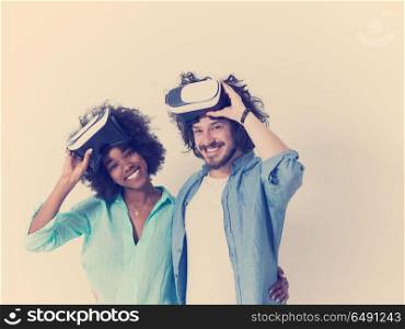 Happy multiethnic couple getting experience using VR headset glasses of virtual reality, isolated on white background. multiethnic couple getting experience using VR headset glasses