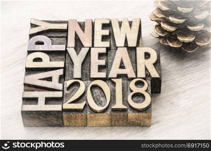 Happy New Year 2018 greeting card - text in vintage letterpress wood type blocks, charco painting digital effect