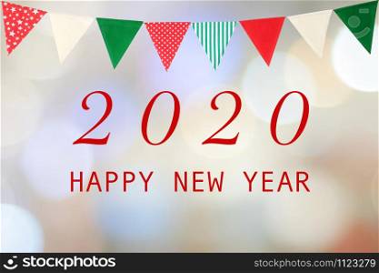 Happy New Year 2020 and colorful bunting flag on blur abstract bokeh background, new year greeting card, banner