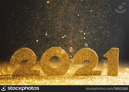 Happy new year 2021 celebration, glitter numbers on blue background. Happy new year 2021 celebration