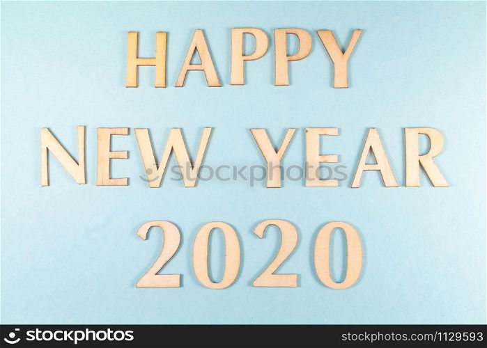 Happy new year and 2020 in wooden figures on blue background
