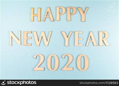 Happy new year and 2020 in wooden figures on blue background