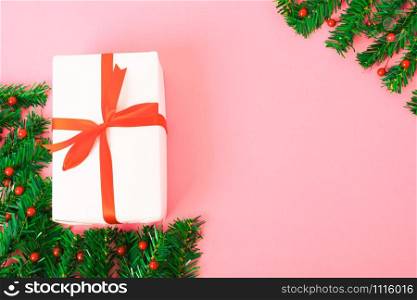 Happy New Year and Christmas day, top view flat lay composition decoration gift box on pink background with copy space for your text