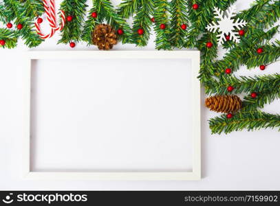 Happy New Year and Christmas day, top view flat lay composition decoration and photo frame on white background with copy space for your text