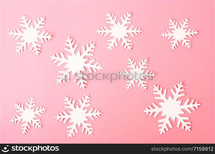 Happy New Year and Christmas day, top view flat lay composition decoration snow white on pink background with copy space for your text