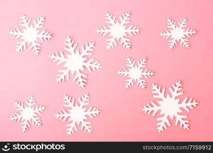 Happy New Year and Christmas day, top view flat lay composition decoration snow white on pink background with copy space for your text