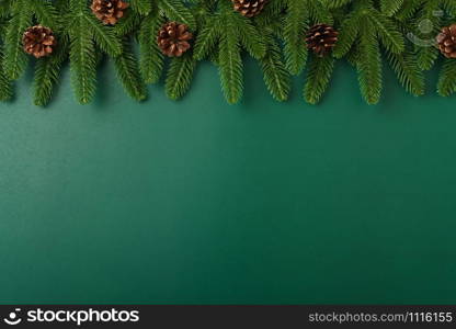 Happy new year, christmas day concept top view flat lay fir tree branches and decoration on Olive Green background with copy space for your text