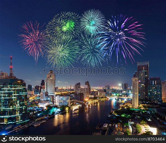 happy new year fireworks celebrating over Chao Phraya river cityscape in Bangkok city at night, Thailand
