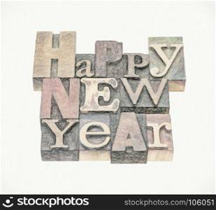 Happy New Year greeting card - text in mixed vintage letterpress wood type blocks with a digital charcoal painting effect applied