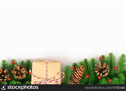 Happy new year or christmas day top view decorative fir tree and gift box on white background with copy space for your text