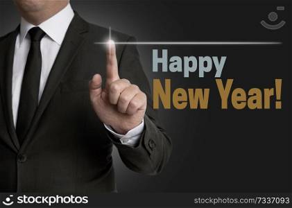 Happy New year touchscreen operated by businessman concept.. Happy New year touchscreen operated by businessman concept