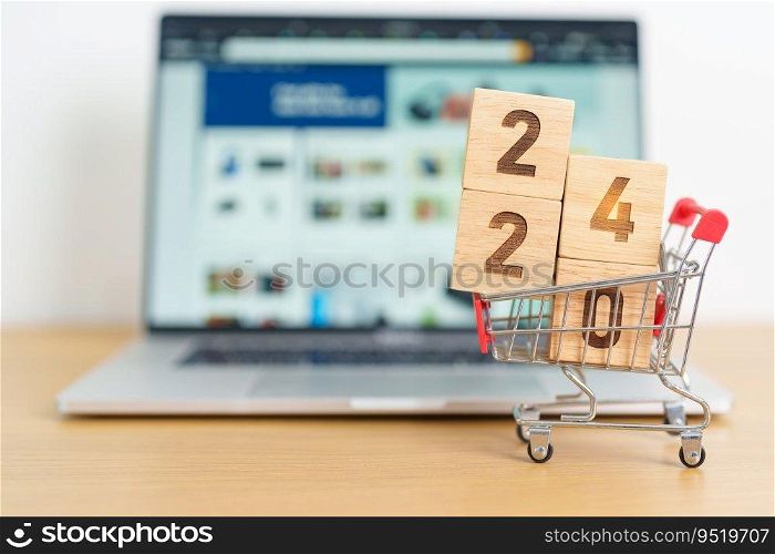 Happy new year with 2024 block in shopping trolley cart on table. E commerce, online shopping, finance, consumer economy and celebration concepts