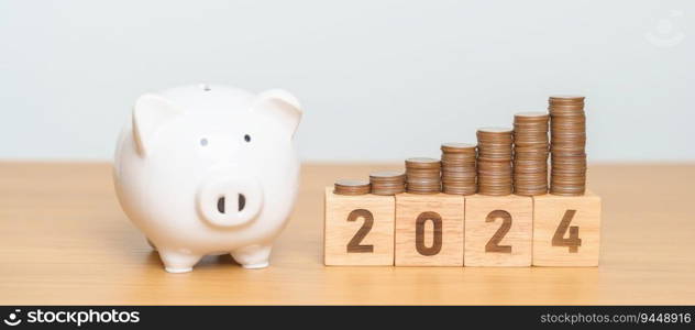 Happy New Year with piggy bank and flipping 2023 change to 2024 block. Resolution, Goals, Plan, Action, Money Saving, Retirement fund, Pension, Investment and Financial concept