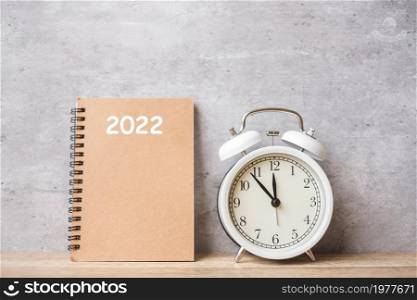 Happy New Year with vintage alarm clock and 2022 calendar. Christmas, New Start, Resolution, countdown, Goals, Plan, Action and Motivation Concept