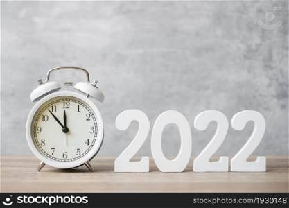 Happy New Year with vintage alarm clock and 2022 number. Christmas, New Start, Resolution, countdown, Goals, Plan, Action and Motivation Concept