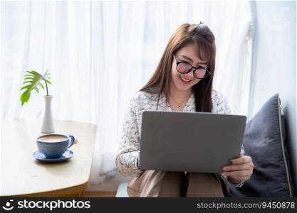Happy of asian freelance people business female casual working with laptop computer with coffee cup and smartphone in coffee shop ,communication concept