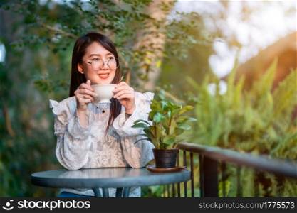 Happy of asian people business female hold a coffee cup mug casual Relaxed in the morning in coffee shop,Business Lifestyle concept