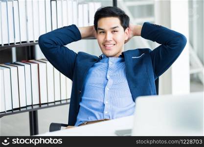 Happy of successful asian young businessman on laptop computer, tablet with blank touch screen isolated and Pen on notebook on White wooden table background in office