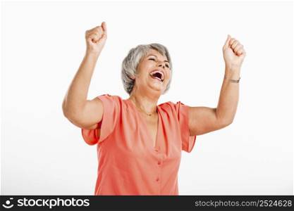 Happy old woman with both arms on the air, isolated on a white background