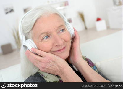 happy old woman with headphones