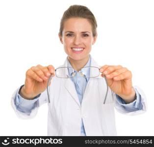 Happy ophthalmologist doctor woman giving glasses
