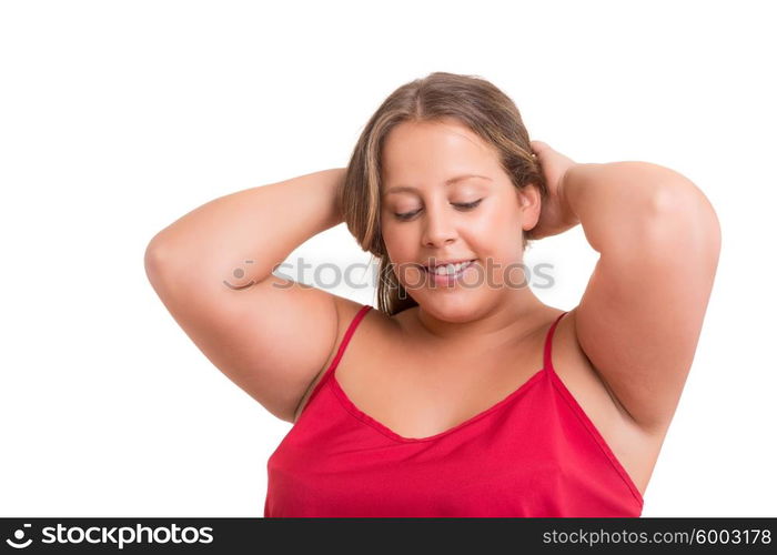 Happy overweighted woman posing isolated over white background