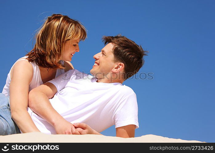 happy pair plays on the beach