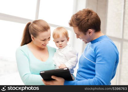 happy parents and adorable baby with tablet pc